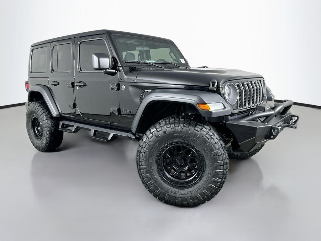 2026 Jeep Wrangler WRANGLER 4-DOOR SPORT in Black Clear-Coat Exterior Paint — front three-quarter view