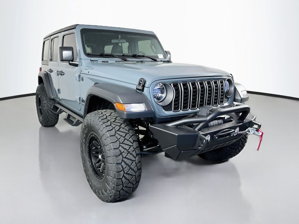 2026 Jeep Wrangler WRANGLER 4-DOOR SPORT in Anvil Clear-Coat Exterior Paint — front three-quarter view