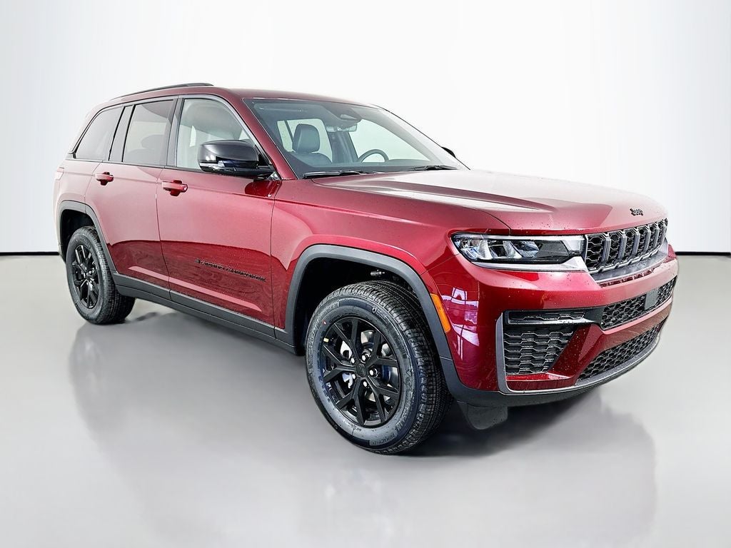 2026 Jeep Grand Cherokee GRAND CHEROKEE LAREDO ALTITUDE 4X4 in Velvet Red Pearl-Coat Exterior Paint — front three-quarter view