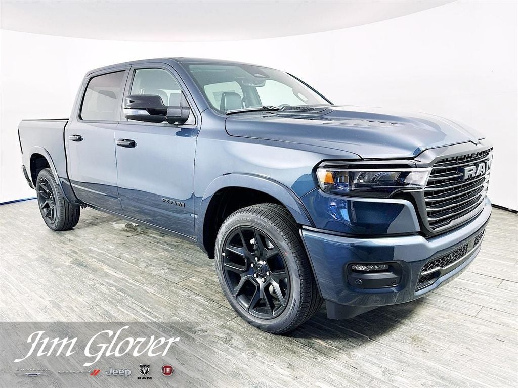 2026 RAM 1500 Laramie Crew Cab 4x4 5'7' Box in Forged Blue Metallic — front three-quarter view