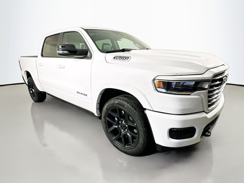 2026 RAM 1500 RAM 1500 LARAMIE CREW CAB 4X4 5'7' BOX in Bright White Clear-Coat Exterior Paint — front three-quarter view
