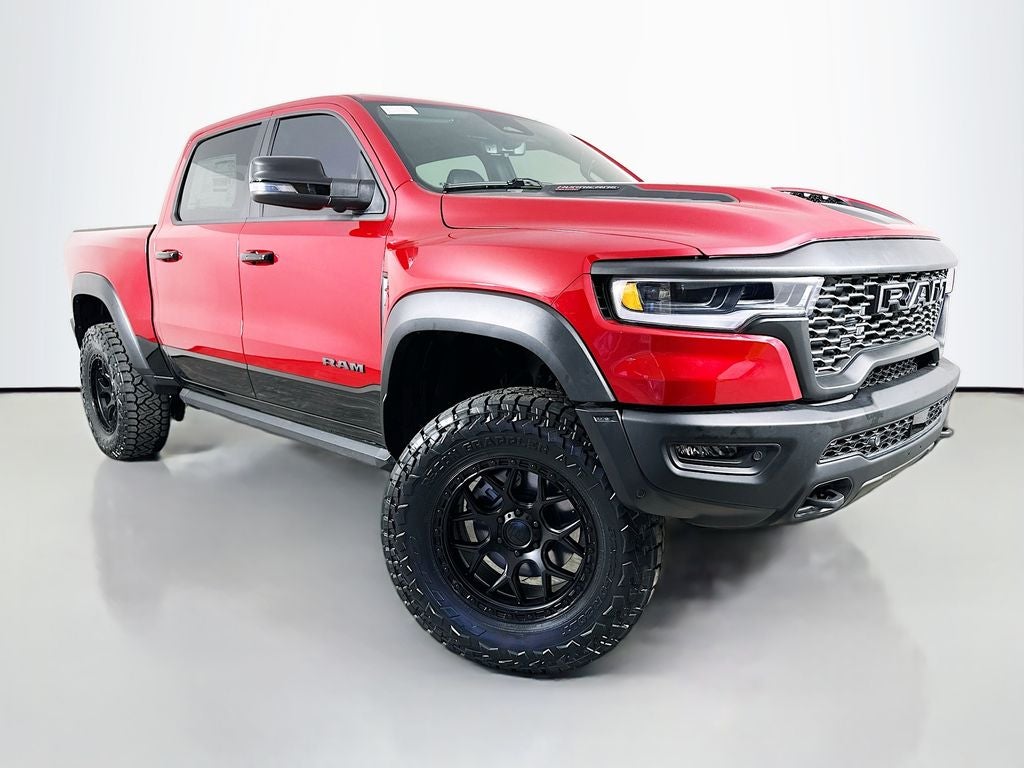 2026 RAM 1500 RAM 1500 RHO CREW CAB 4X4 5'7' BOX in Molten Red Pearl-Coat Exterior Paint — front three-quarter view