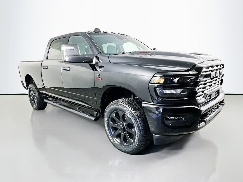 2026 RAM 2500 RAM 2500 BLACK EXPRESS CREW CAB 4X4 6'4' BOX in Diamond Black Crystal Pearl-Coat Exterior Paint — front three-quarter view