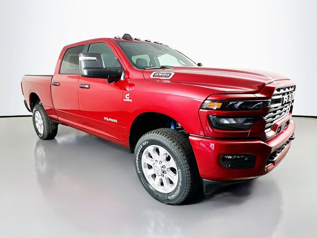 2026 RAM 2500 RAM 2500 BIG HORN CREW CAB 4X4 6'4' BOX in Molten Red Pearl-Coat Exterior Paint — front three-quarter view